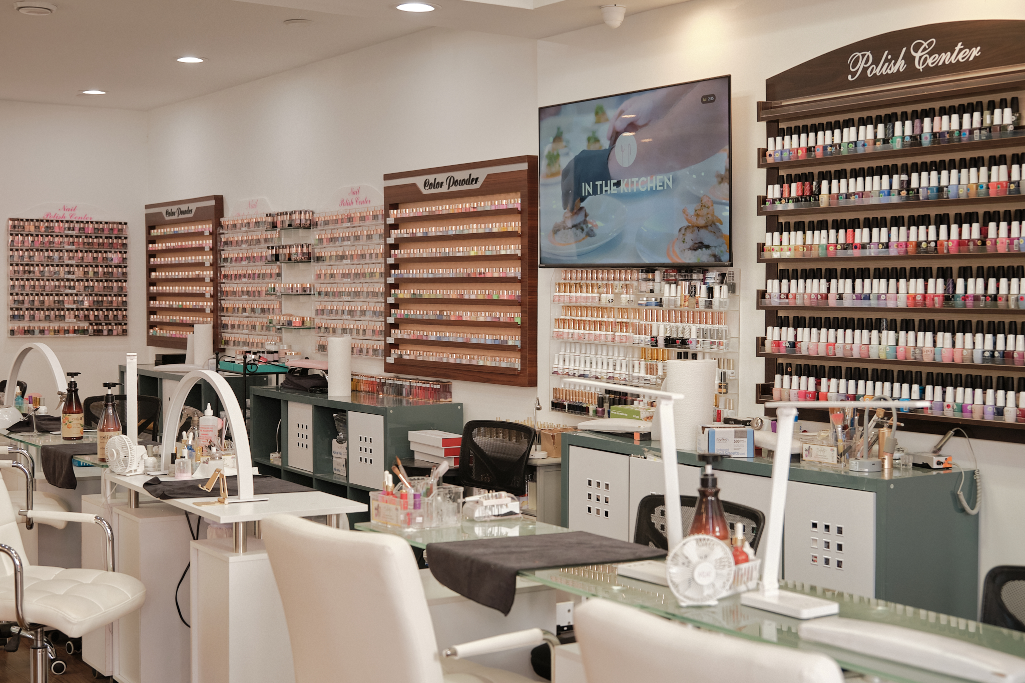 Vibrant nail polish display at NailàCarte nail salon showcasing a variety of colors and finishes.