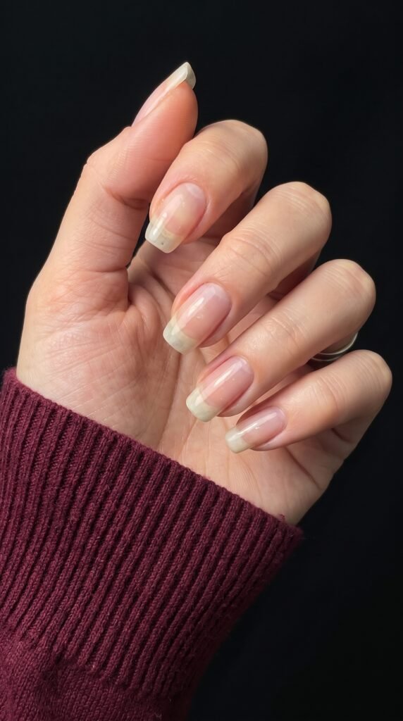 A healthy natural almond nail bed preparing for protective travel nail inspo