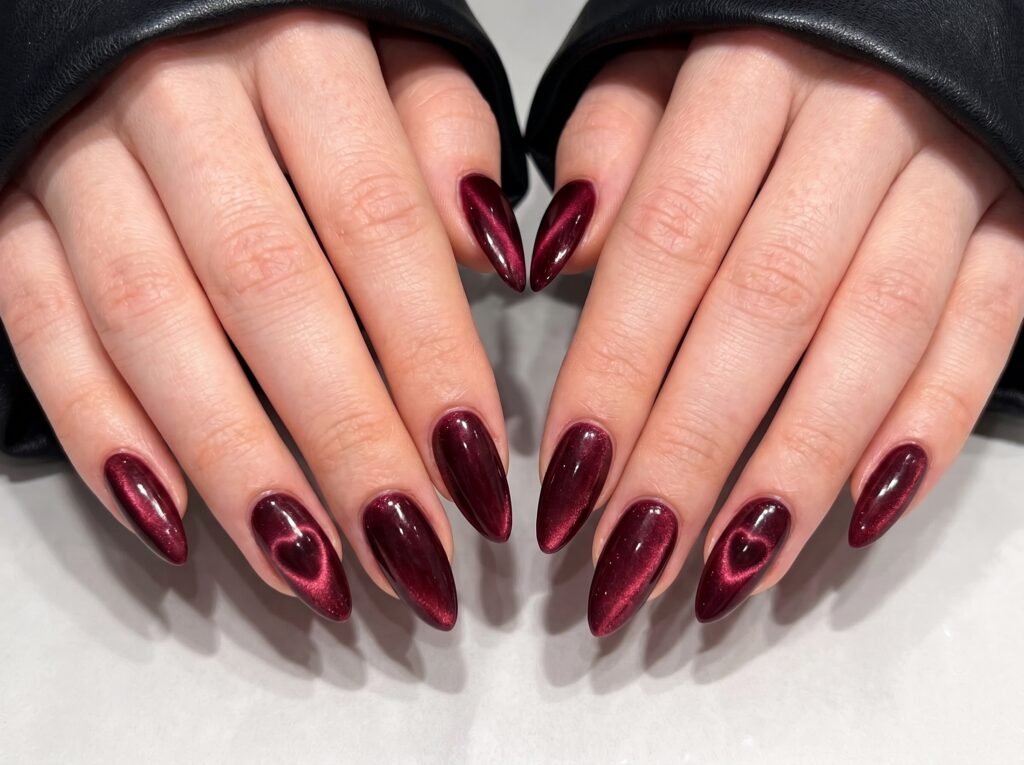 velvet cat eye nails with soft magnetic glow on long almond nails