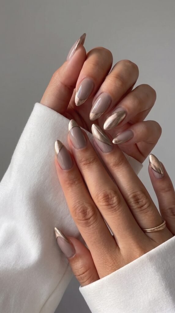 An elegant champagne metallic french tip manicure maintained perfectly at our fullerton nail spa