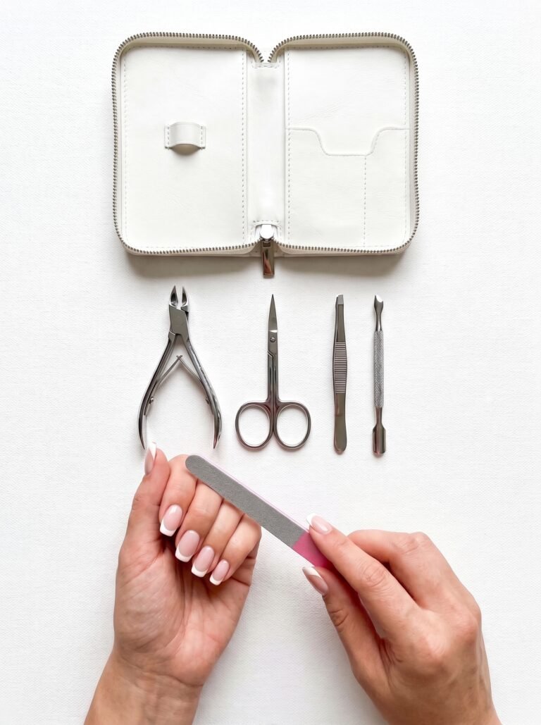 A professional stainless steel nail kit open with premium executive grooming tools