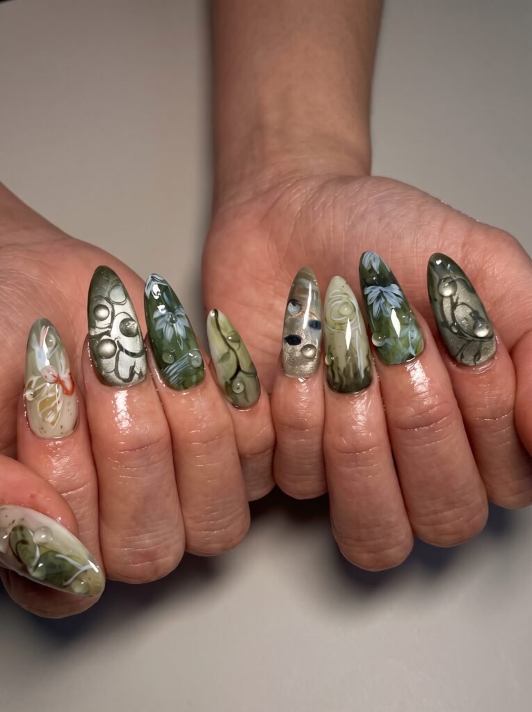 Deep pine green magnetic velvet cat-eye gel polish featuring dimensional fall nail designs.