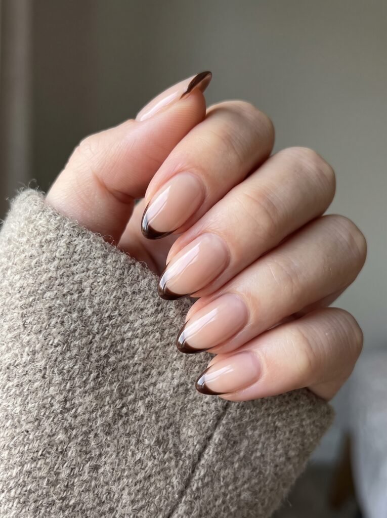Dark roast espresso micro-French tips showcasing minimalist fall nail designs 2026 at NailàCarte.