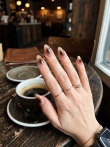 Diffused dark espresso aura halo manicure featuring modern classy nail designs River North at NailàCarte.