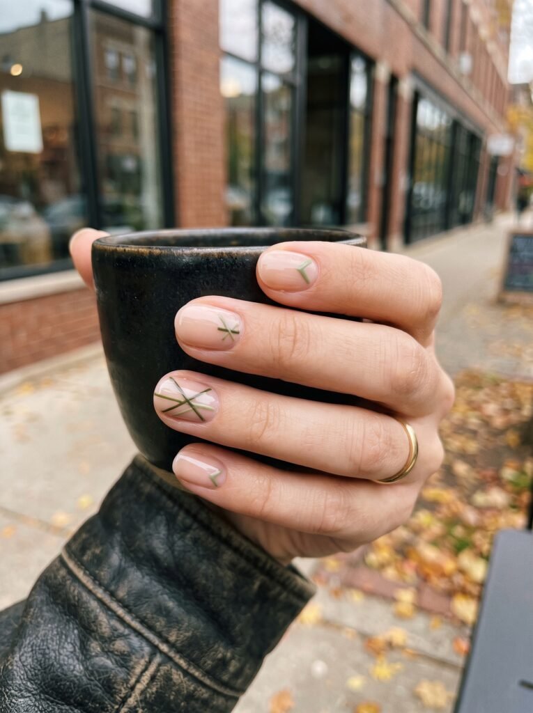 Black olive and muted pistachio micro-accents showcasing september nail ideas Wicker Park at NailàCarte.
