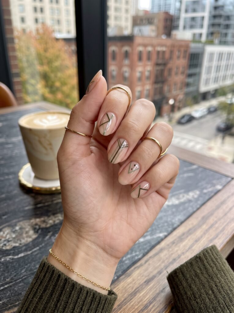 Molten silver 3D liquid metal drips on nude BIAB for futuristic fall 2026 nail color trends river north.