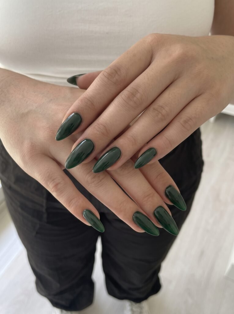 Rich velvet forest green pedicure featuring luxury fall toe nail colors at NailàCarte.