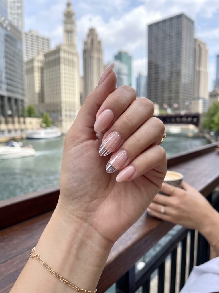 Clear 3D glass ribs on a sheer blush-pink dip powder manicure at NailàCarte.