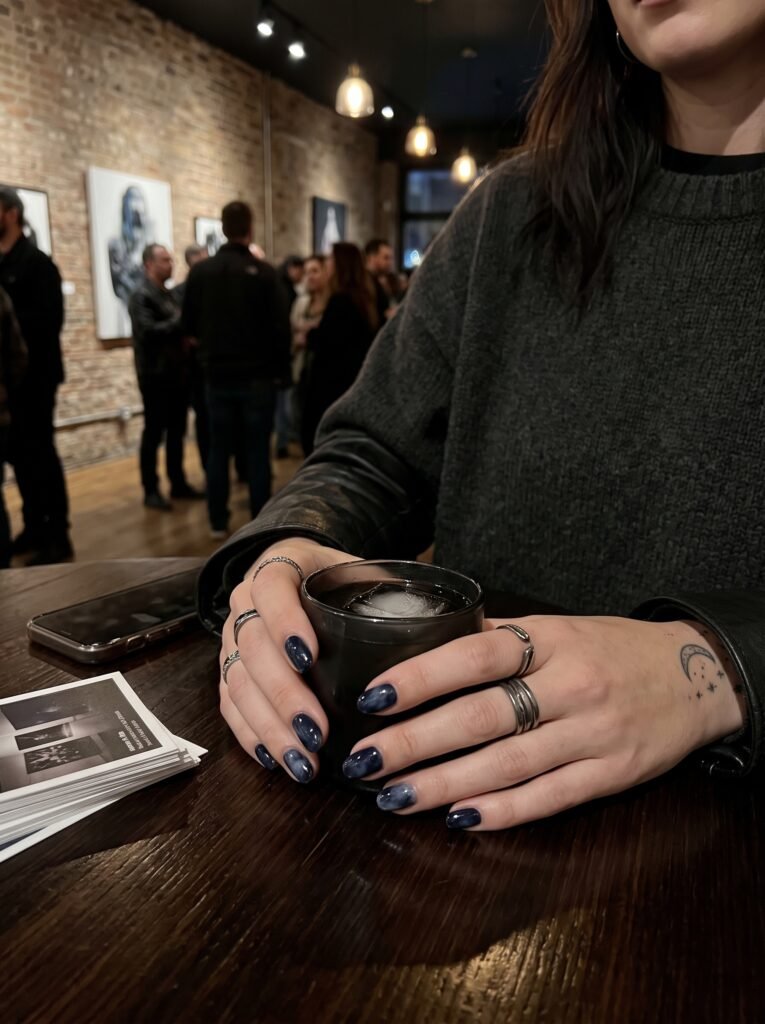 High-gloss midnight ink and charcoal smoke nails, a moody fall 2026 trend in Wicker Park.