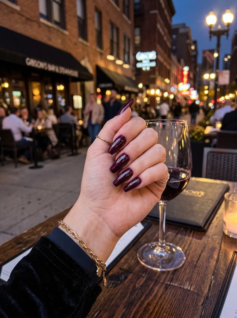 High-gloss dark plum and cherry cola manicure on a slim coffin Gel-X shape, featuring gel-x nails Gold Coast styles.
